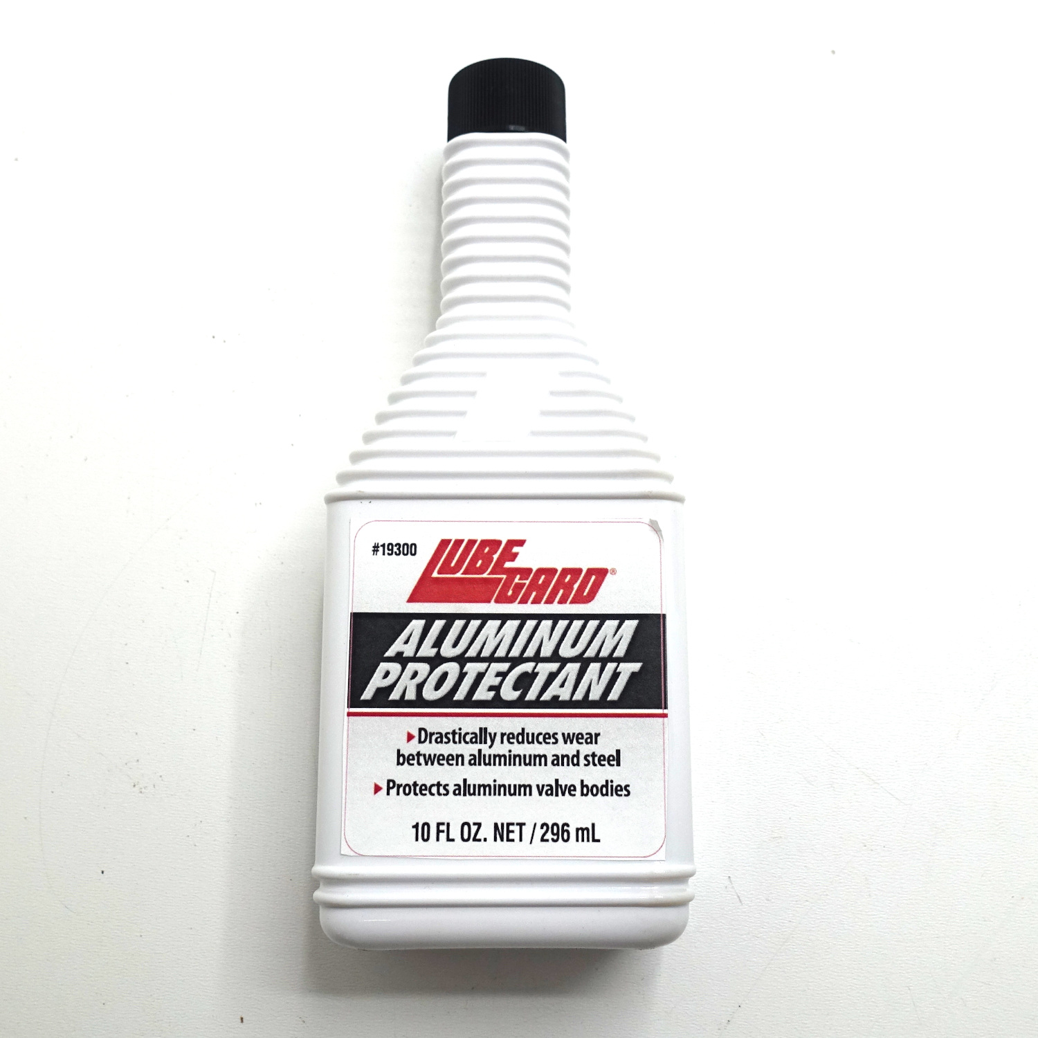 08.LU.19300 DESCRIPTION
LUBEGARD® Aluminum Protectant reduces aluminum-on-aluminum and steel-on-aluminum wear by adding anti-wear protection which is not currently present in today's automatic transmission fluids.

It protects aluminum that is in contact with steel or other aluminum, such as valve bodies, servo bores, and pistons. It reduces aluminum valve body wear by up to 30%. It will not affect viscosity and can even help prevent torque converter shudder by reducing valve body T/C circuit wear. It is also safe for yellow metals such as brass, bronze and copper.

FEATURES & BENEFITS
• Perfect for commercial applications with high mileage, and stop & go driving

• Only a 1 fl. oz. per quart treat rate (3%) is required – a 10 oz. bottle treats a
typical transmission
• Average wear reduction of 35% on aluminum that is in contact with steel or
aluminum, as in valve bodies, servo bores and pistons
• Also improves the anti-wear protection of steel-on-steel contact
• Does not affect viscosity when used in ATF
• Can help prevent T/C shudder by reducing valve body T/C circuit wear
• Restores anti-wear properties to used and new fluids
• Heat and shear stable
• Can be used in other lubricants (engine oil, hydraulic fluid) to enhance
ferrous, non-ferrous, and aluminum anti-wear properties
• Safe for yellow metals, including brass, bronze & copper
• No negative effects on frictional performance
• When added to used ATF anti-wear protection is restored for steel and
aluminum components